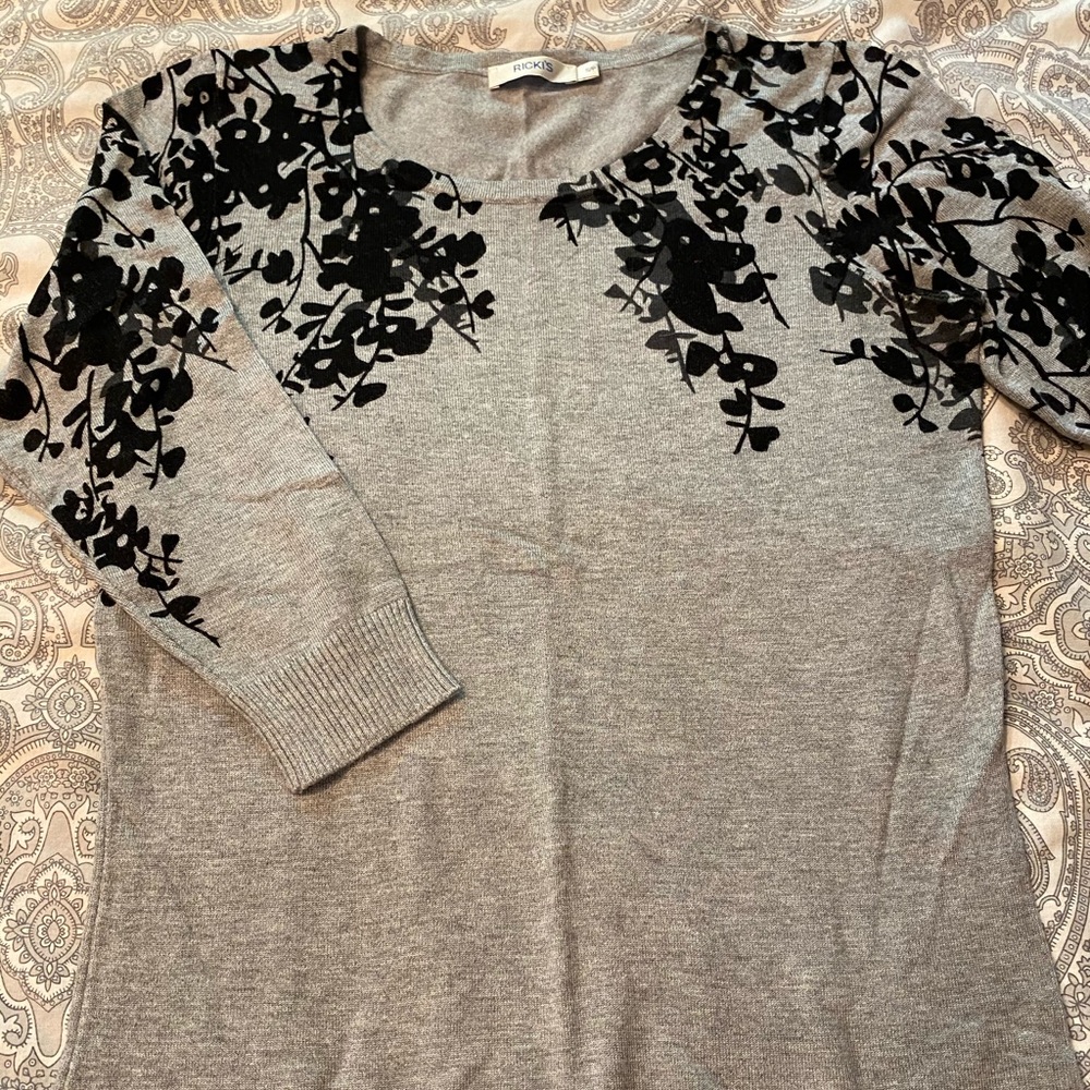 Light woman’s sweater.